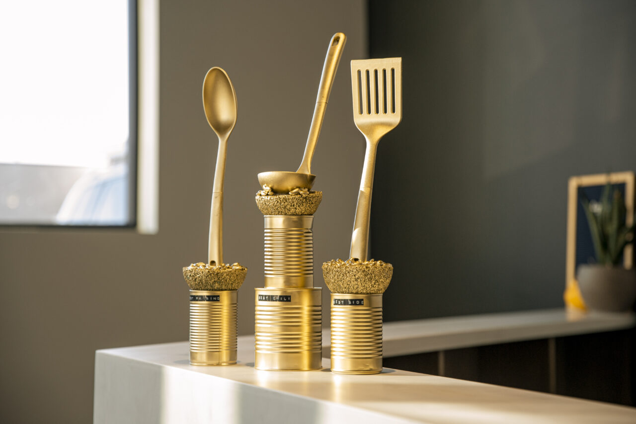 Golden trophies for Lemonly's fall chili cook-off made of cans of beans and ladles