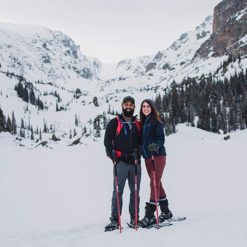 Cortney and her husband, Phil, skiing in snowy mountains